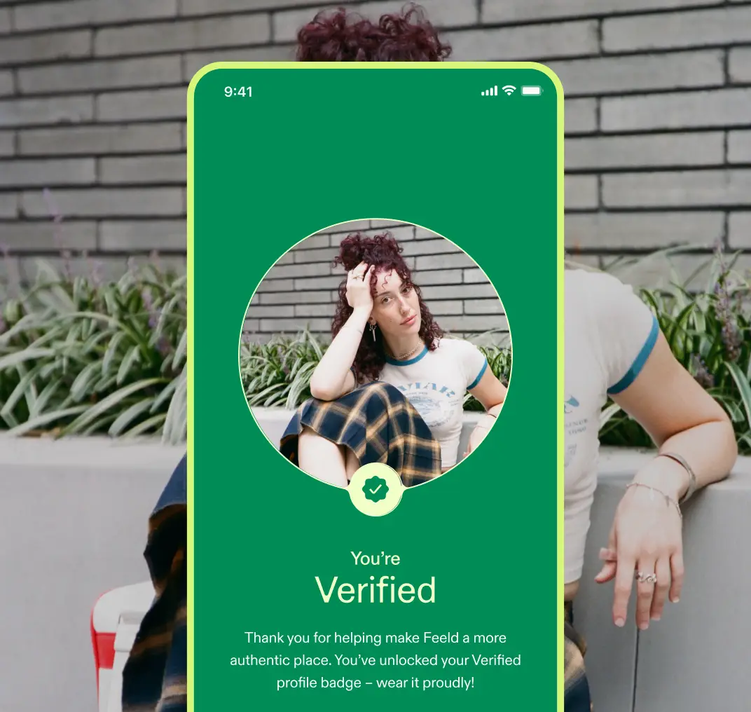 A green screen reading "You're Verified" with a circular photo of a person with curly auburn hair.